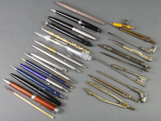 A black Parker fountain pen, minor pens and pencils