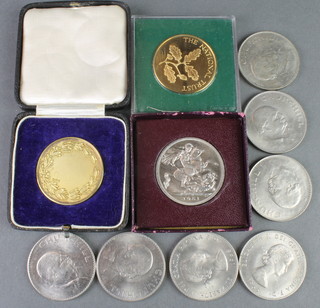 A cased silver medallion and minor crowns