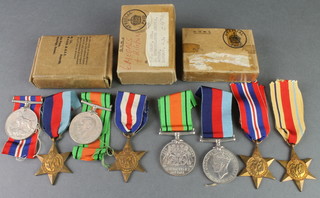 A World War Two group 1939-45 Africa, Italy, France and Germany star, Defence and War medal, in posting box, a ditto 1939-45 France and Germany Star, Defence and British war medal in postage box, a ditto 1939-45 Africa Star, Defence and War medal in posting box 