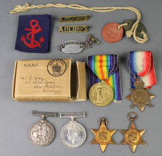 Family group, a World War One trio to 14928 Pte. G. W. Gray. North.R and a Second World War group France and Germany 1939-45 Star and war medal together with dog tags, associated paperwork etc 