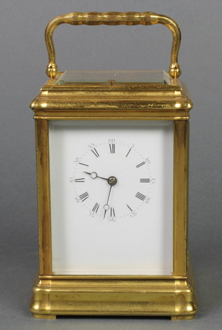 A 19th Century French 8 day repeating carriage clock with enamelled dial and Roman numerals contained in a gilt metal case 5" 