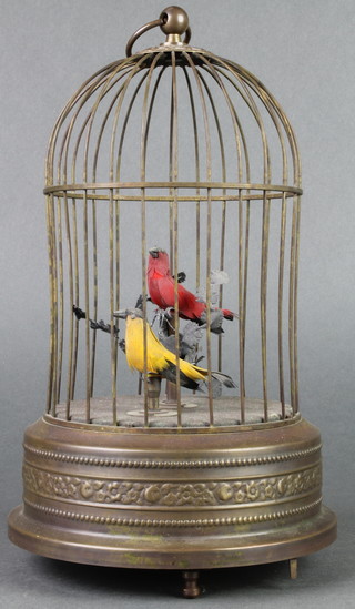 A reproduction Victorian singing bird automaton in the form of 2 caged birds 10" 