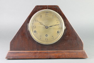 An Art Deco chiming mantel clock with silvered dial and Arabic numerals contained in a mahogany pyramid shaped case