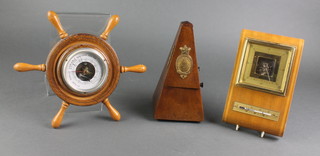 De Maelzel, a metronome, an aneroid barometer in the form of a ships wheel 6", a 1950's aneroid barometer and thermometer 9" 