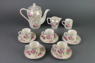 A Crownford gilt and floral decorated coffee set 