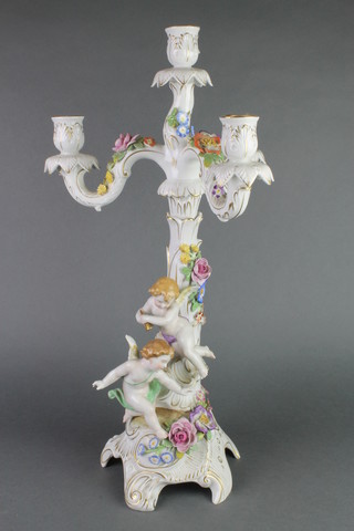 A mid 20th Century German candelabrum with 4 lights having applied angels and flowers 18" 