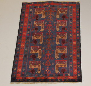 A red and blue ground Herati rug decorated animals 24" x 35 1/2" 