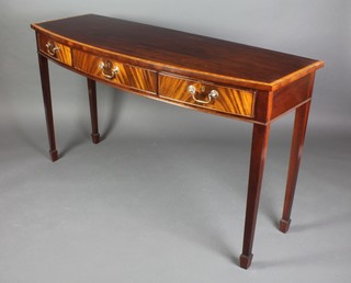 A Georgian style mahogany bow front side table with crossbanded top fitted 1 long drawer flanked by 2 short drawers, raised on square tapering supports ending in spade feet 34"h 