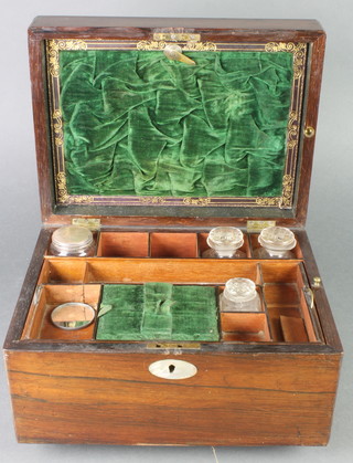 A Victorian rosewood vanity case with hinged lid, fitted 4 glass bottles and with drawer to the base 7"h x 12"w x 9"d 