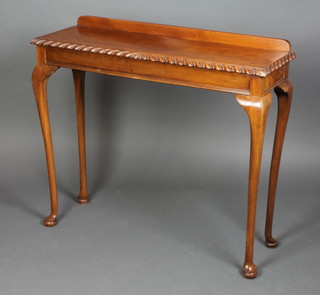 A Chippendale style rectangular mahogany side table with raised back, raised on cabriole supports 31"h x 36"w x 12"d 