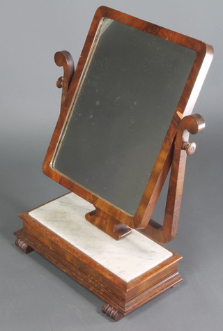 A 19th Century Continental rectangular plate dressing table mirror contained in a mahogany swing frame, the rectangular base inset a white marble panel and raised on scroll supports 28"h x 18 1/2w x 9"d 