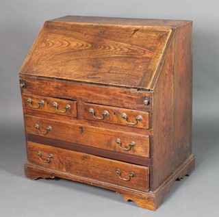 An 18th Century elm bureau, the fall front revealing a well fitted interior with well, above 2 short and 2 long drawers, 35"h x 33"w x 18"d 