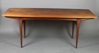A 1960's rectangular teak dining table, raised on tapered supports 29"h x 78"l x 31"w 