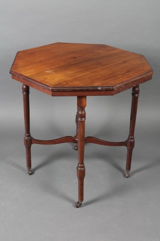 An Edwardian octagonal walnut occasional table with X framed stretcher raised on turned supports 29"h x 29"w x 29"d 