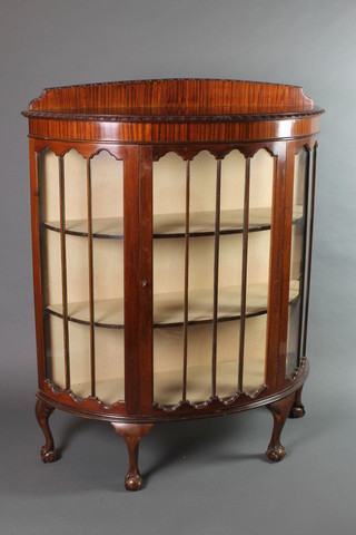A 1930's mahogany Chippendale style bow front display cabinet with raised back, the shelved interior enclosed by astragal glazed panelled doors, raised on cabriole, ball and claw supports 52"h x 42"w x 16"d 