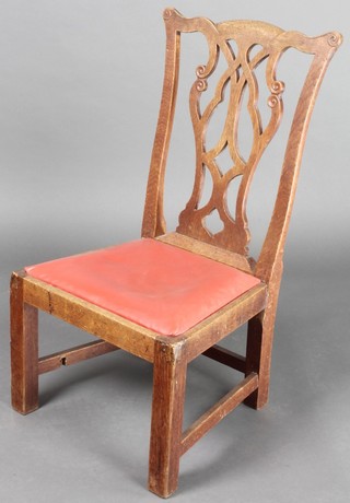 A 19th Century oak Chippendale style childs chair with vase shaped slat back and upholstered drop in seat, raised on square tapering supports 