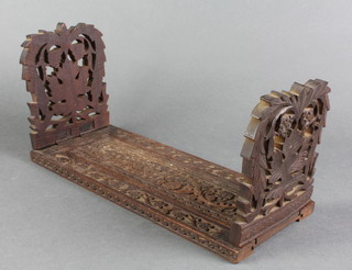 A pair of Victorian Indian carved hardwood expanding bookends 6 1/2"h x 13" when closed by 22" when fully extended x 5 1/2"d 