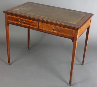 An Edwardian inlaid mahogany writing table with green inset writing surface and crossbanded top, fitted 2 short drawers with brass swan neck drop handles 28"h x 36"w x 21"d 