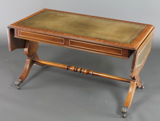 A miniature Georgian style sofa table with inset leather surface, raised on lyre supports with turned stretcher 20"h x 50"w x  36"l when closed x 54"l when opened 