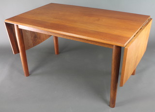 A 1960's rectangular teak drop flap dining table raised on turned supports 28"h x 52"l when closed x 85"l x when opened x 32"w 