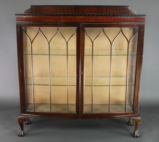 A 1930's mahogany Chippendale style display cabinet, fitted shelves enclosed by astragal glazed panelled door on cabriole supports 52 1/2"h x 48"w x 15"d  