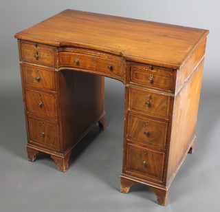 A Victorian mahogany kneehole pedestal dressing table fitted a brushing slide above 1 long and  8 short drawers, raised on bracket feet 30"h x 33"w x 20"d 