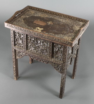 A rectangular 19th Century Indian pierced and carved hardwood tray with folding stand 23"h x 21"w x 13 1/2"d 