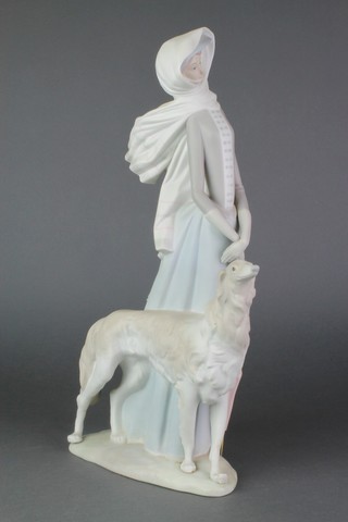 A Lladro matt figure of a lady with Afghan hound 15 1/2" 