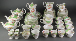 A Paragon Rockingham extensive tea and coffee set comprising 3 teapots, 1 coffee pot, 4 sandwich plates, 2 medium plates, 6 small plates, 20 cake plates, 6 dessert bowls, 4 small bowls, 8 tea cups, 3 coffee cups, milk jug, 2 cream jugs, 2 slop bowls, 4 egg cups, giant tea cup and 18 saucers 