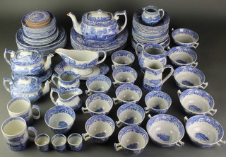 An extensive matched Spode and Copeland Spode Italian Garden tea and dinner service comprising 9 tea cups, 6, 2 handled cups, 2 tea pots, 5 jugs, a sauce boat on stand, large teapot and base, 2 coffee cups, a slop bowl, 3 egg cups, placemats, 10 saucers, 6 small plates, 7 medium plates, 8 large dinner plates, 6 dessert bowls, 5 other bowls, a dish and 6 medium plates 