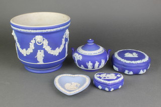 A Wedgwood Jasperware jardiniere decorated figures and vinous swags, a sugar bowl, a lidded box, heart box and dish 