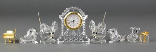 A Waterford Crystal timepiece 2 3/4", 5 Swarovski crystal animals, 2 other crystal items 