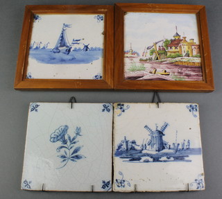 A 19th Century Delft tile depicting a windmill in landscape 5" x 5" a ditto of a flower and 2 others