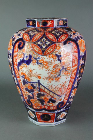 A 19th Century Imari octagonal oviform vase decorated with garden landscapes on a field of flowers 14 1/2" 