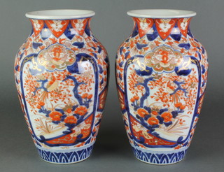 A pair of Imari oviform vases decorated with panels of flowers 10 1/2" 