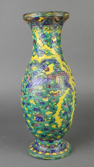 A Chinese yellow and green glazed baluster vase with elongated neck decorated with exotic birds amongst clouds 16" 