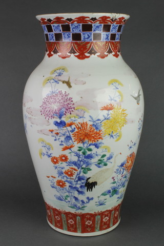 A 19th Century Japanese oviform vase decorated with birds amongst flowers beneath a geometric collar 19 1/2" 