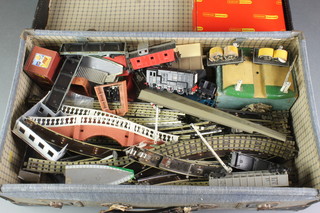 A Meccano transformer no.T20, various Hornby OO track, buildings etc contained in a blue fibre suitcase 