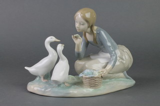 A Lladro figure of a kneeling girl with geese 9", boxed 