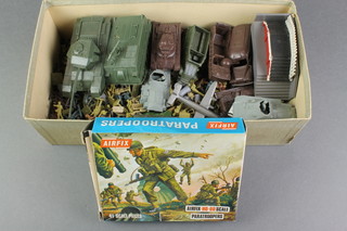 A small box containing a collection of various made up Airifix military vehicles etc 