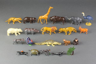 A collection of various animal figures, various pressed metal figures of animals and a metal figure of a partridge
