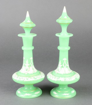 A pair of Victorian green glass scent bottles overpainted with scrolls and flowers 9" 