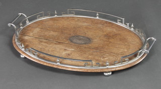 An Edwardian oval oak twin handled tea tray with chrome gallery 3"h x 22"w x 15"d 