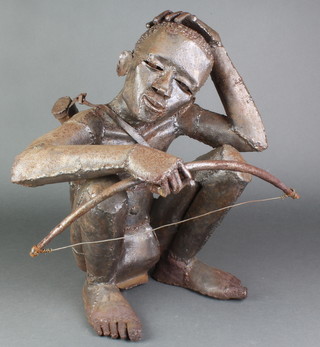 A 20th Century African steel sculpture of a tribesman with bow 18" 