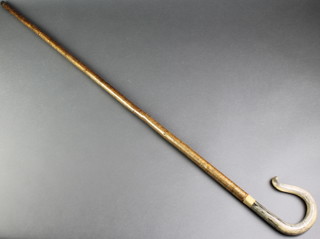 A crook with carved horn handle 