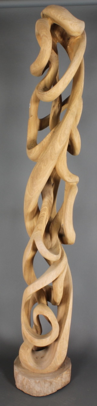 A Tanzanian carved and bleached hardwood sculpture "Felix" 81" 
