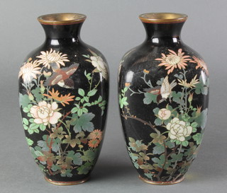 A pair of 19th Century Japanese black ground and floral patterned cloisonne vases decorated birds amidst branches 7" 