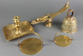 2 curious brass drop trivets 5" and 4", a 19th Century brass chamberstick, 19th Century brass oil lamp and a bell 