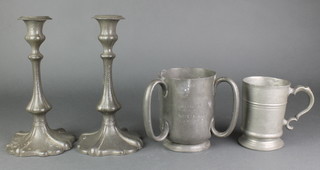 A pair of Art Nouveau Park Pewter planished candlesticks 10", an Edwardian 3 handle pewter trophy for the Fambridge Yacht Club and a Victorian pewter pint tankard 
