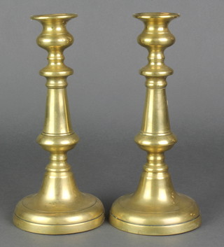 A pair of 18th Century brass candlesticks with ejectors 9 1/2" 